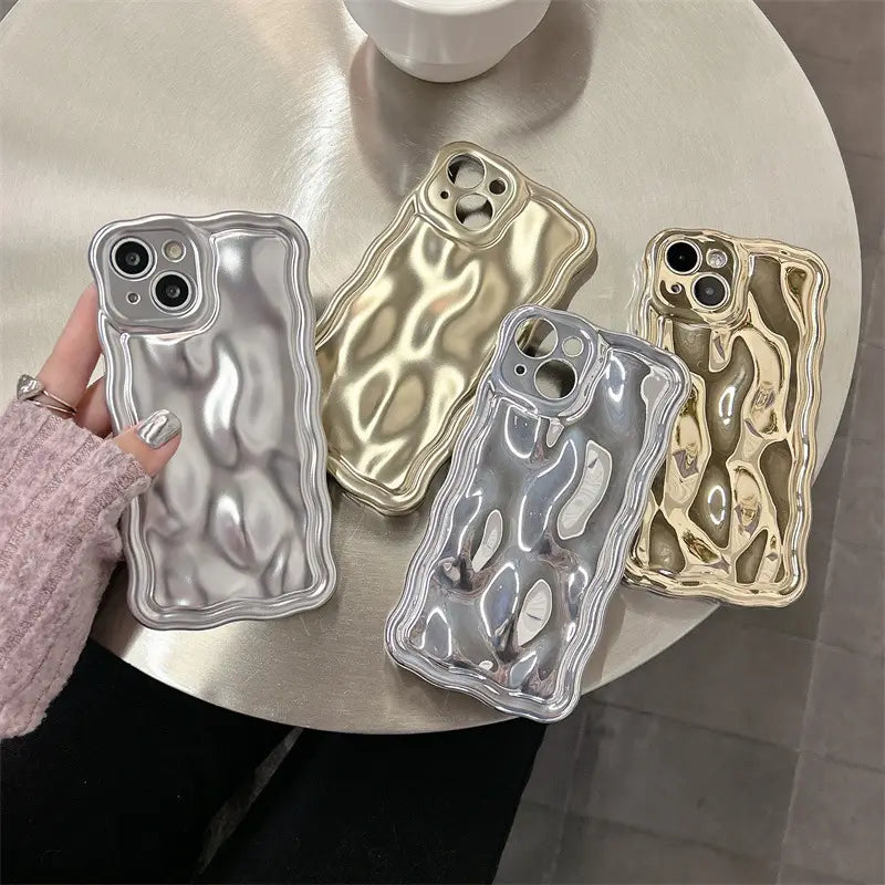 shiny metallic iphone cases in silver and gold with a wavy textured electroplated surface shown from the back side for enhanced protection