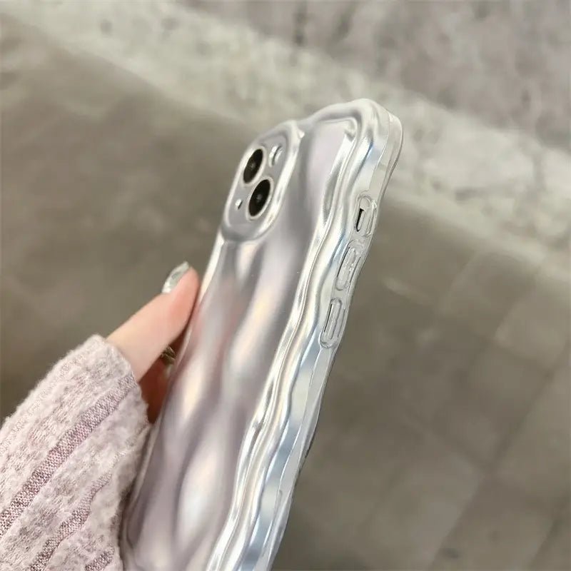 transparent silver ripple-patterned wavy metallic iphone case electroplated protection showing the back side with a glossy wave-like texture