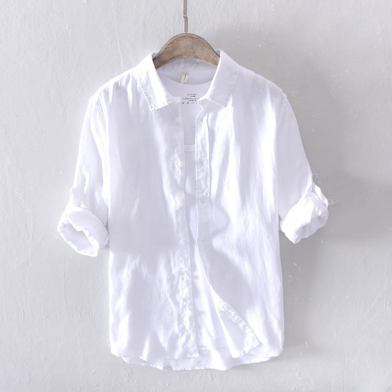 Men’s premium 100 percent linen long sleeve casual shirt in white with rolled sleeves hanging on a wooden hanger
