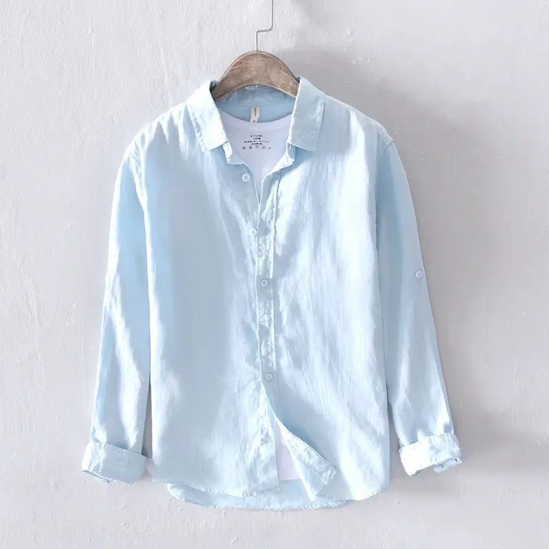 A light blue men’s premium 100 percent linen long sleeve casual shirt with rolled cuffs and a classic collar.