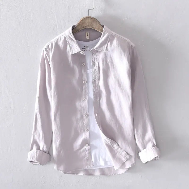 A light gray men’s premium 100 percent linen long sleeve casual shirt with a classic collar and rolled cuffs.