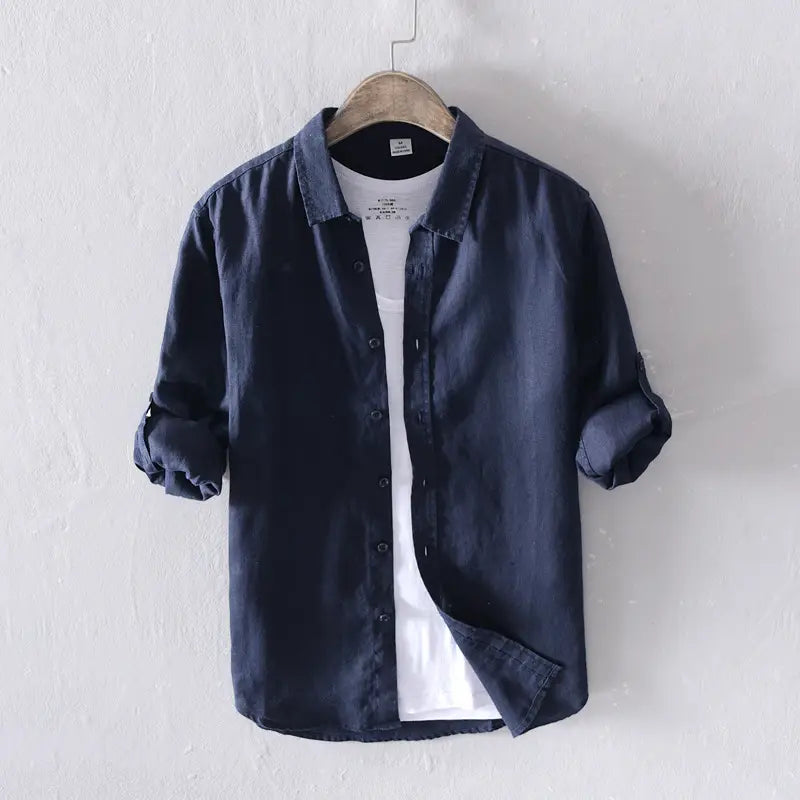 Men’s premium dark blue 100 percent linen long sleeve casual button-up shirt with a collar and rolled sleeves.