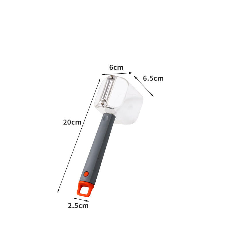 Éplucheur de légumes en acier inoxydable avec des poignées grises et orange et un protecteur en plastique transparent.