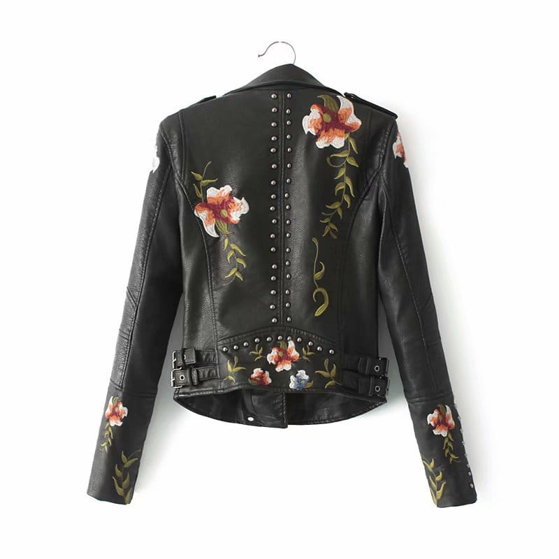 Black leather moto jacket featuring embroidered pink and white flowers along the back sleeves and waistband shown from the back side.