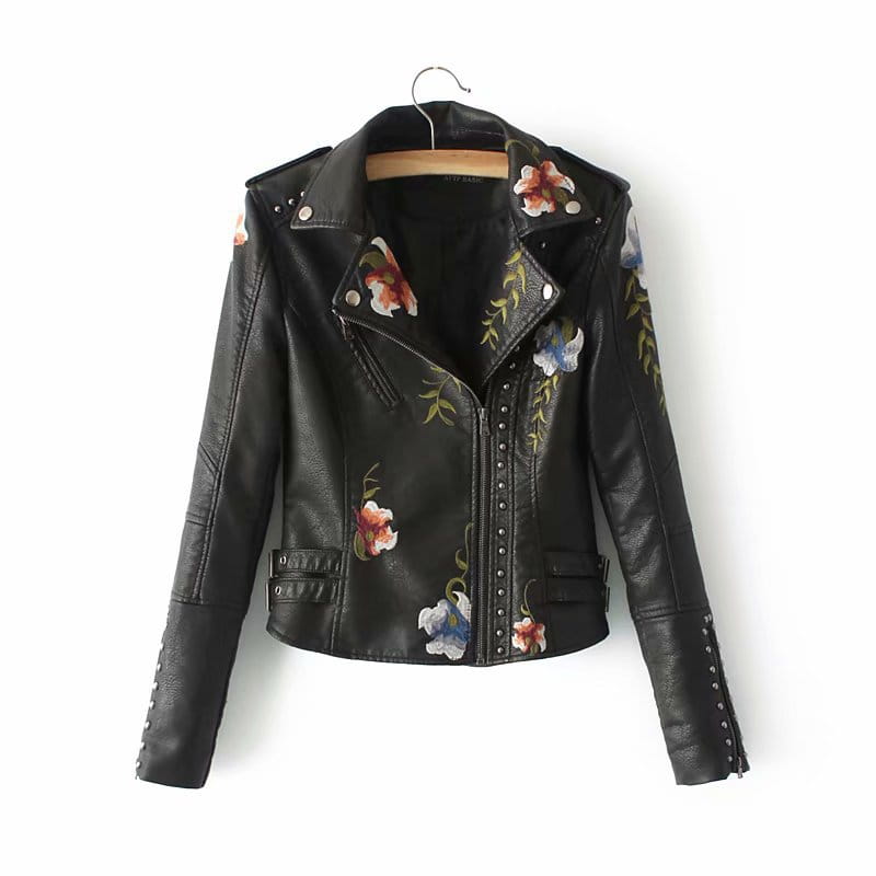 Black leather moto jacket with colorful floral embroidery and studded detailing displayed from the back side.
