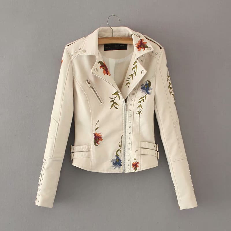 Cream-colored leather biker jacket featuring colorful floral embroidery and silver studs titled floral embroidered studded leather moto jacket.