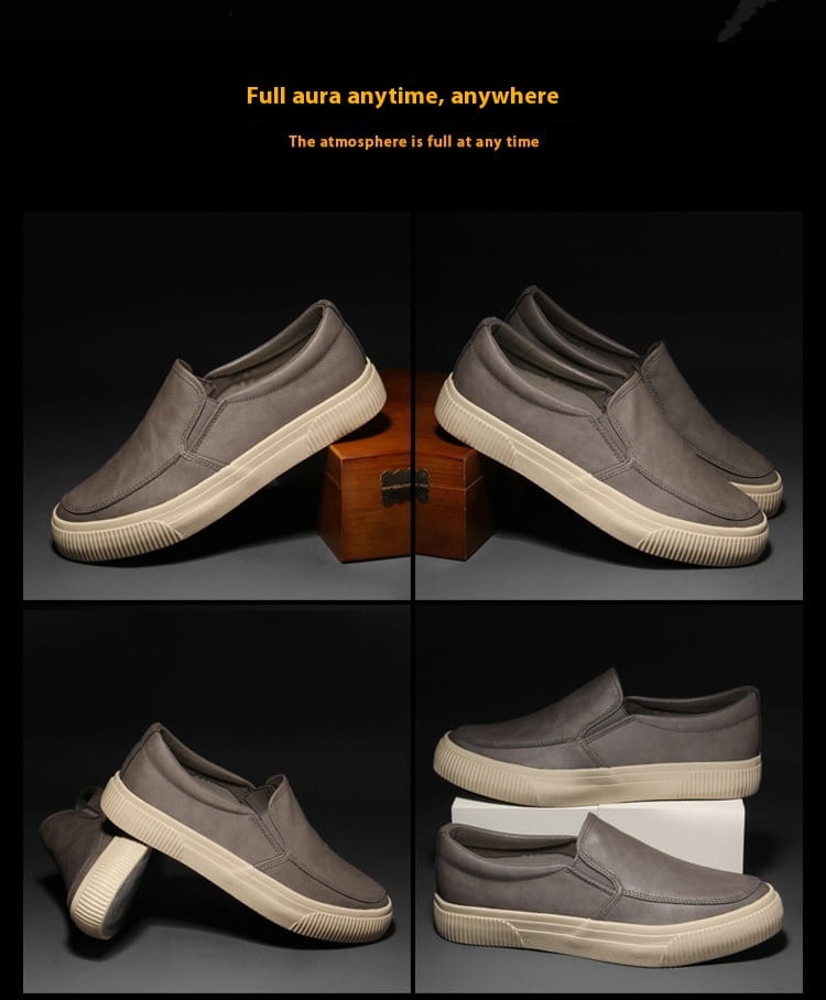 Men’s leather slip-on casual fashion sneakers in gray with a textured upper and contrasting off-white rubber soles.