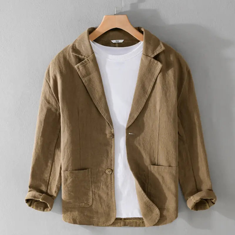 Veste blazer décontractée en lin pour hommes de couleur beige, coupe ample, dotée de deux poches avant et de fermetures à boutons.