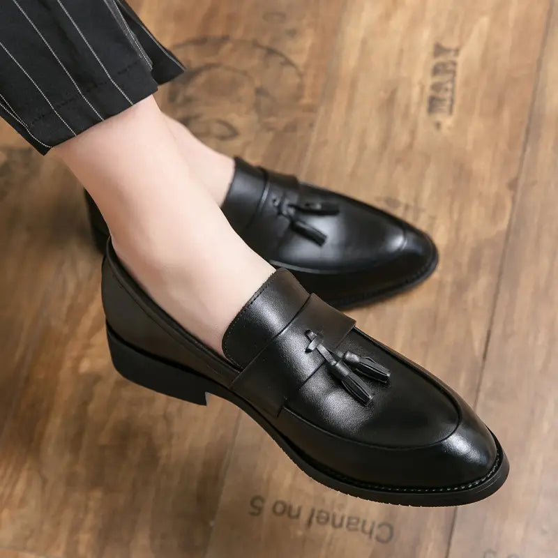 Black leather tassel loafers with a polished finish and low heel for men classic leather dress shoes