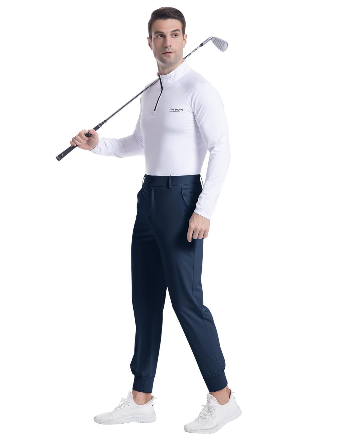 A man wearing white long-sleeved golf shirt with slim fit navy blue men’s stretch golf jogger pants suitable for athletic use.