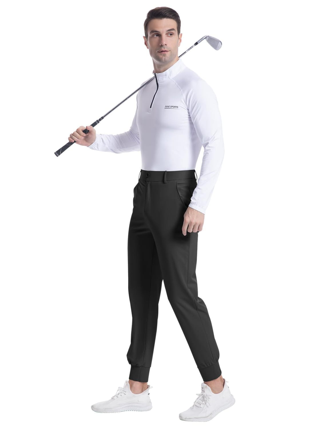 Men’s stretch golf jogger pants slim fit trousers paired with a white long-sleeved golf shirt featuring a black zipper detail and a subtle brand logo on the chest.
