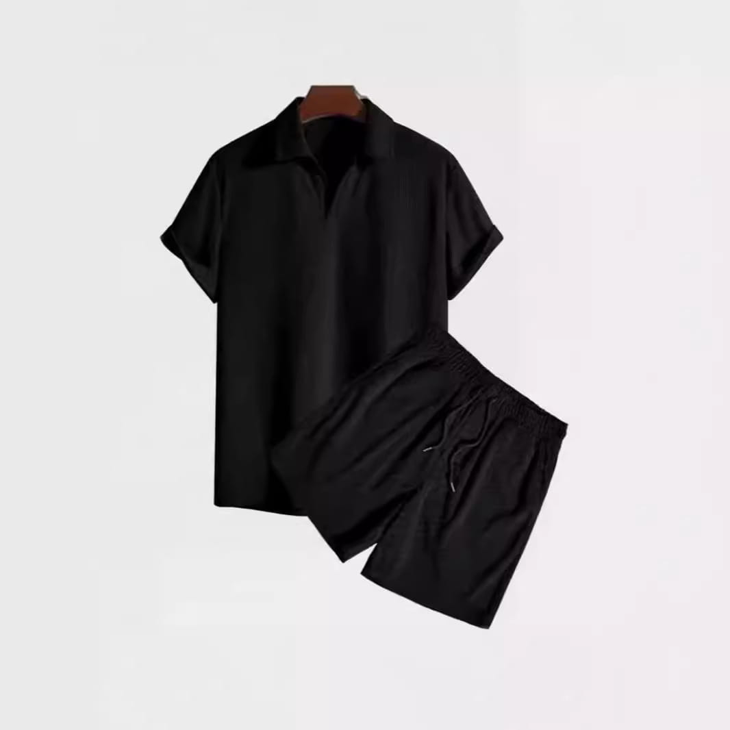 Men corduroy short sleeve polo shirt and matching drawstring shorts set in black displayed from the front.