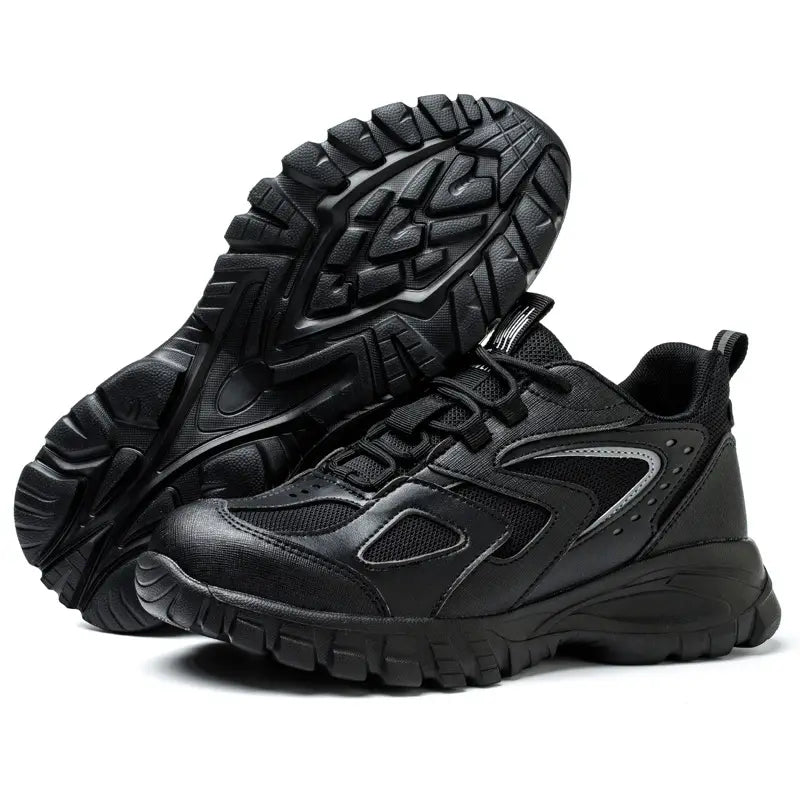 Men’s indestructible mesh athletic safety shoe in black with synthetic overlays and a rugged outsole design.