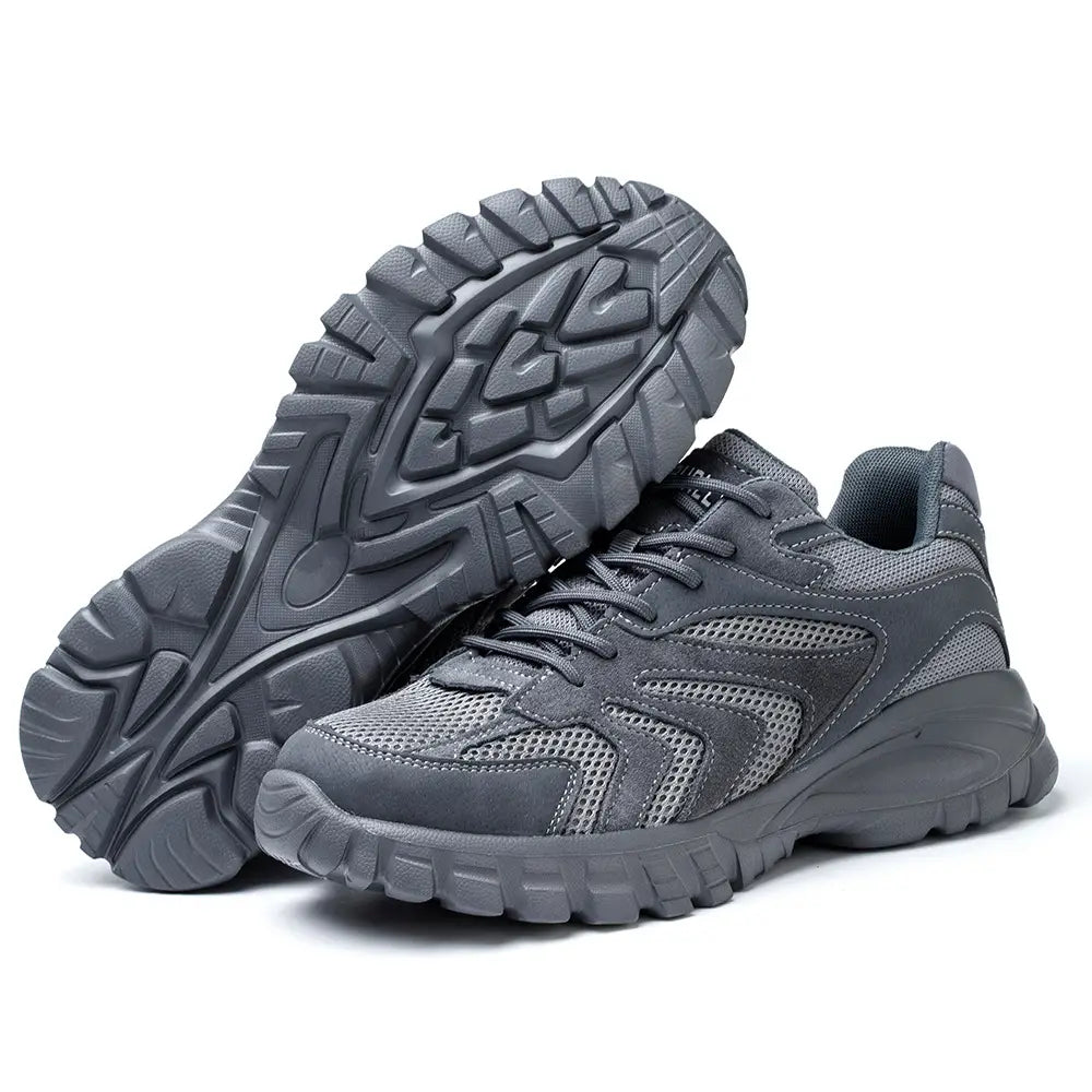 Men’s indestructible mesh athletic safety shoes in gray with a mesh and synthetic upper, thick rubber sole, and rugged tread pattern.