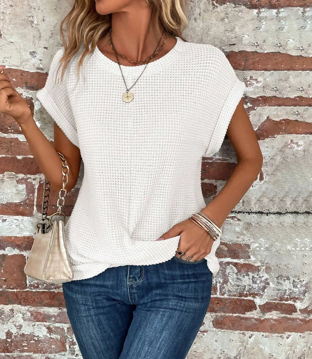 White textured knit short-sleeved top for women featuring a relaxed fit and waffle knit fabric