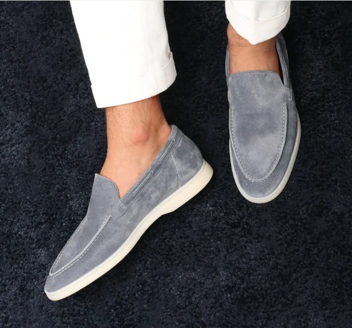 men’s matte suede slip on loafers in gray featuring a white rubber sole designed for casual wear