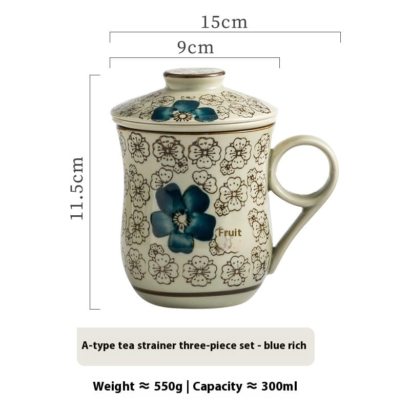 Cream-colored ceramic tea mug with infuser and matching lid featuring intricate blue and black floral patterns with a 300ml capacity.