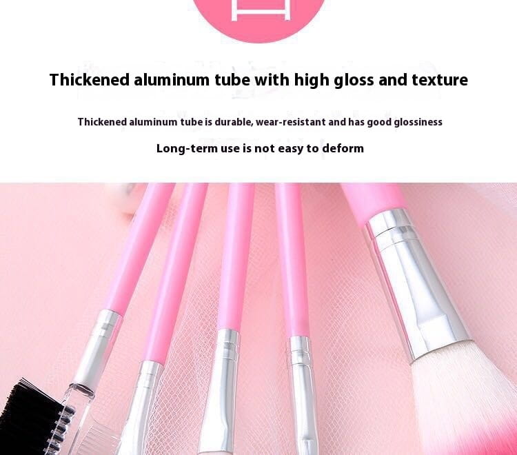 Ensemble de pinceaux de maquillage en cinq pièces comprenant des pinceaux à manche rose, des viroles en métal argenté et des poils dégradés rose doux, logés dans un tube en aluminium renforcé.
