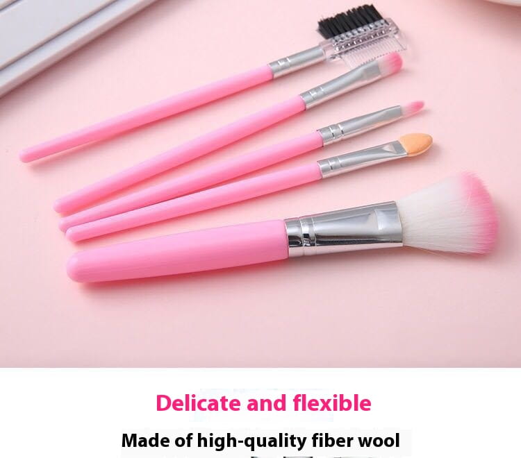 Ensemble de pinceaux de maquillage comprenant cinq pièces avec des poils en laine de fibres dégradées roses et des viroles en argent, conçu pour l’application cosmétique.