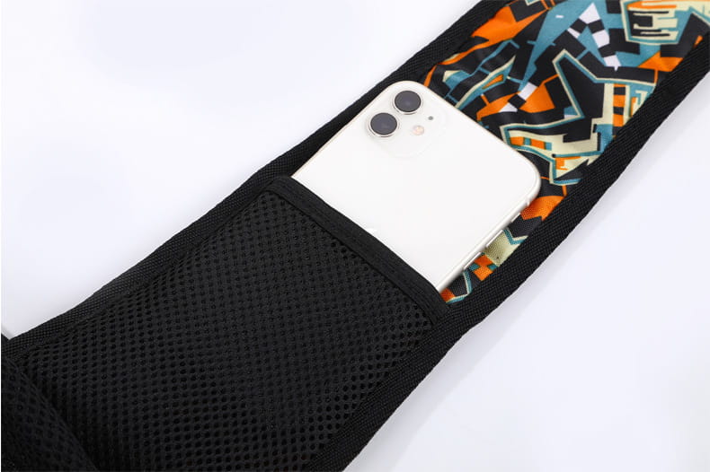 Black mesh pet carrier sling bag with vibrant orange teal and black geometric inner lining designed for small dogs and cats.