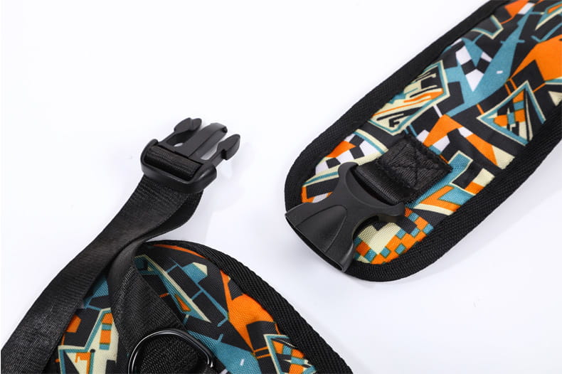 Vibrant geometric patterned shoulder strap with bold orange teal and black abstract design on durable fabric for pet carrier sling bag for small dogs and cats.