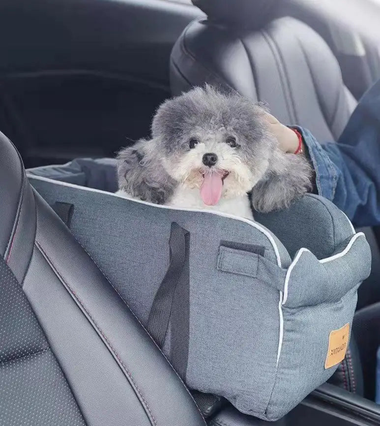 Gray fabric plaid pet carrier bag with white trim and a small orange label designed as a breathable travel dog purse.