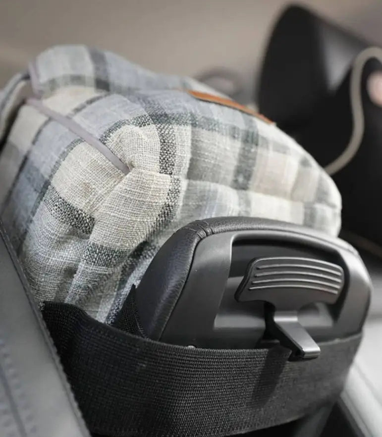 Gray and white plaid breathable pet carrier bag with black plastic handle and strap for travel use