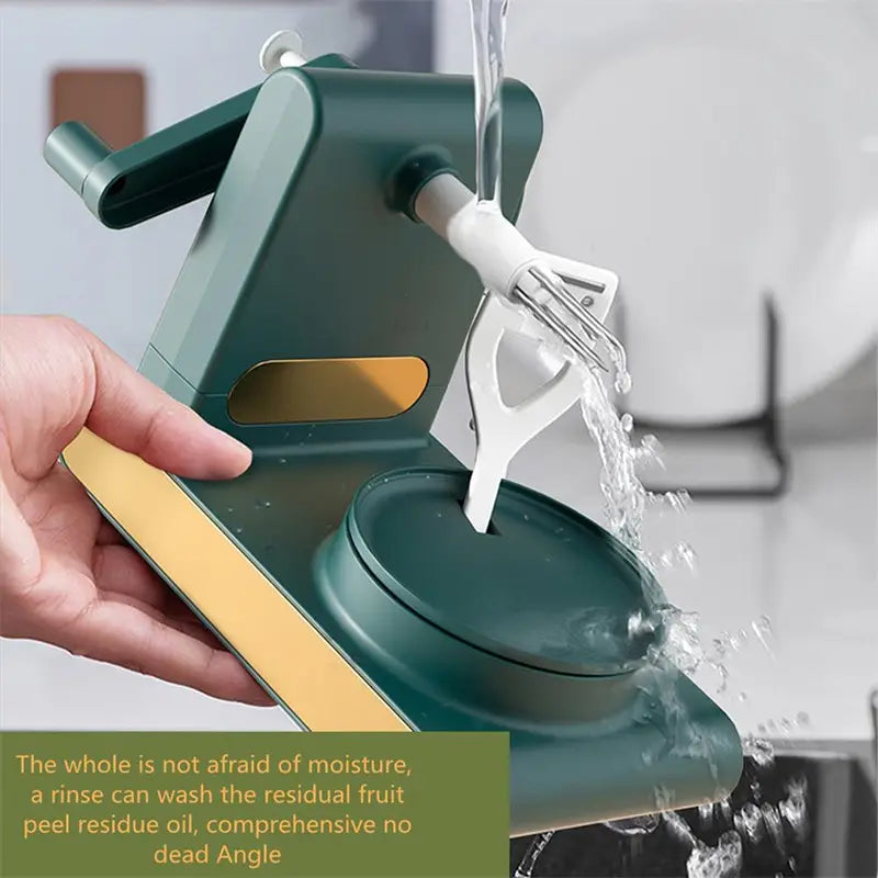Dark green plastic multifunctional apple peeler and slicer tool kit with white and metallic accents designed for efficient fruit peeling and slicing.