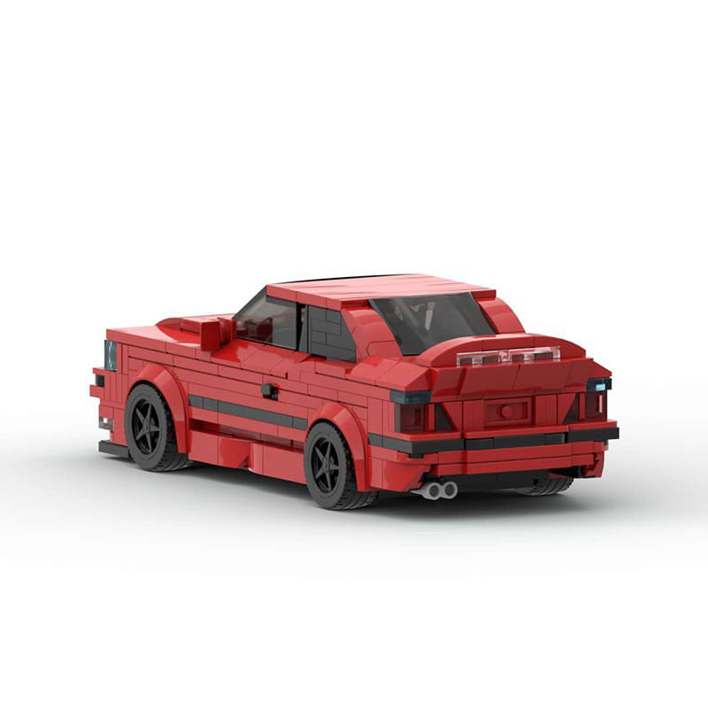 Modèle de voiture de sport E36 construit en Lego rouge, avec pneus noirs et détails, assemblé à partir de 509 pièces de construction, jouet.