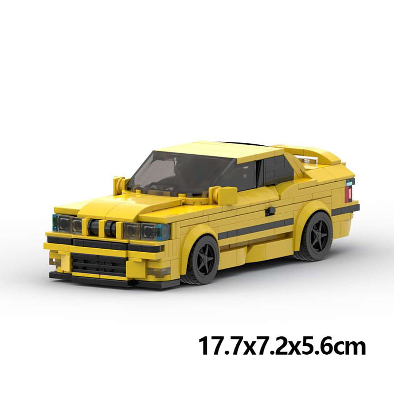 Modèle de voiture de sport BMW E36 M3 construit en Lego jaune éclatant, avec accents noirs et roues détaillées, provenant du modèle de voiture de sport en briques E36, ensemble jouet de 509 pièces.