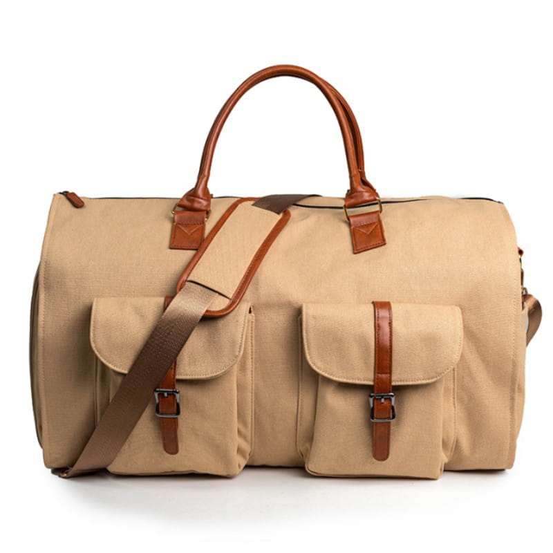 Beige canvas and leather folding travel duffel bag with brown leather handles straps and buckles for multifunctional use