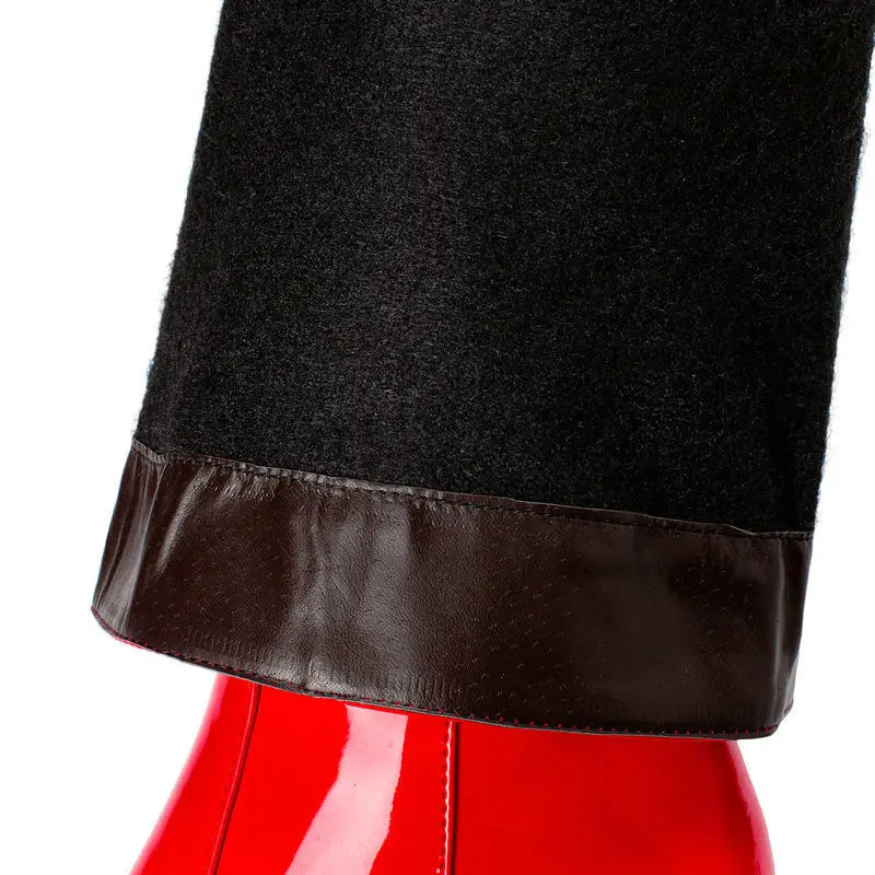 black woolen pant leg with contrasting brown leather cuff paired with patent leather knee high block heel square toe boots.