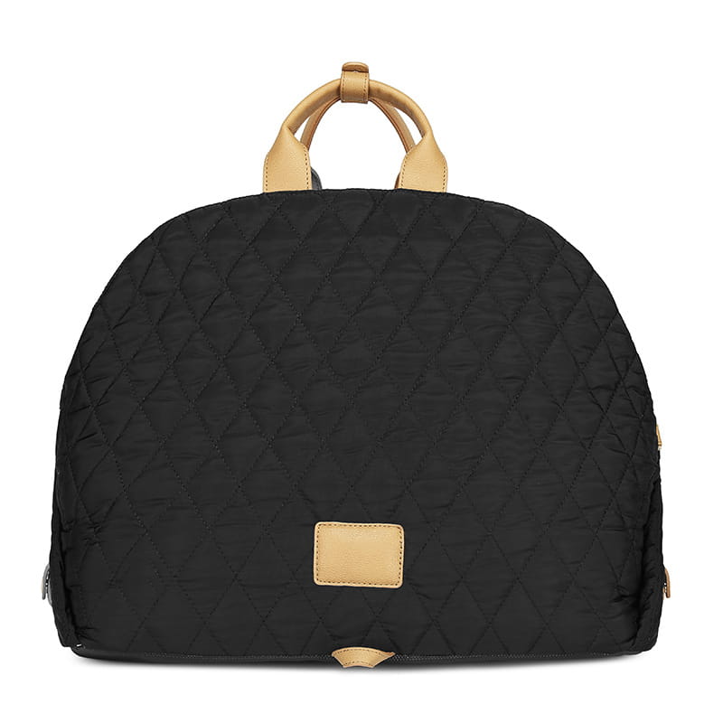 Black quilted travel pet carrier bag with tan leather handles and a matching rectangular patch.