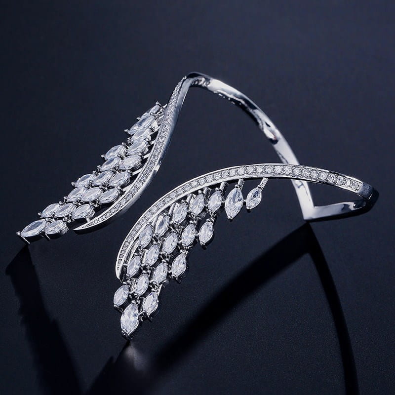 Silver marquise crystal angel wing bangle bracelet featuring wing-shaped design adorned with cascading marquise-cut and round clear crystals.