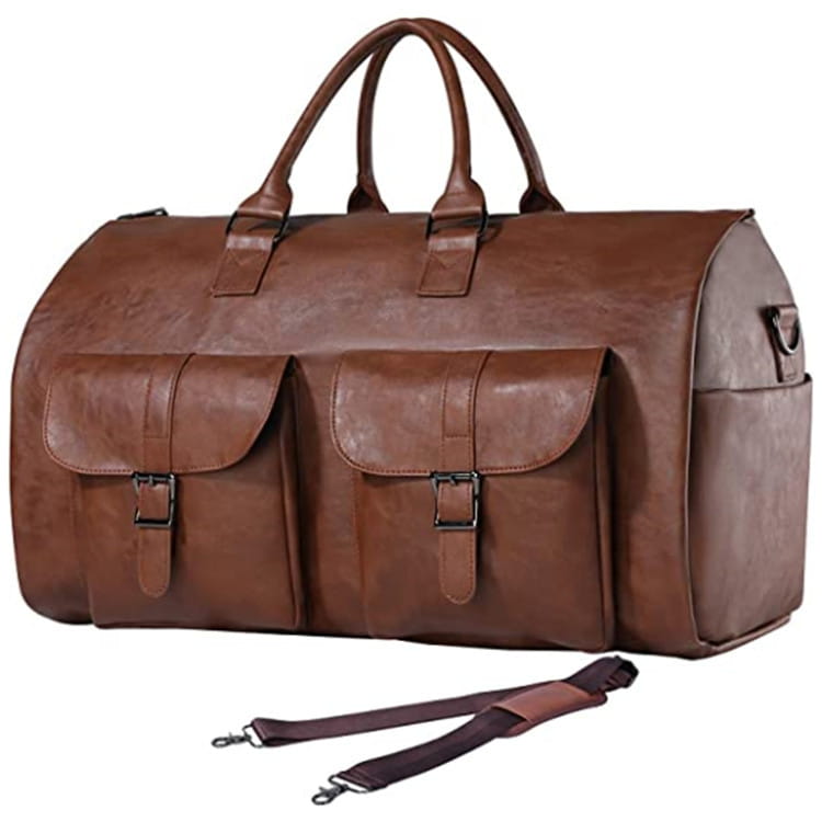 Brown leather convertible travel garment bag with two front flap pockets, a detachable shoulder strap, and a shoe pocket.