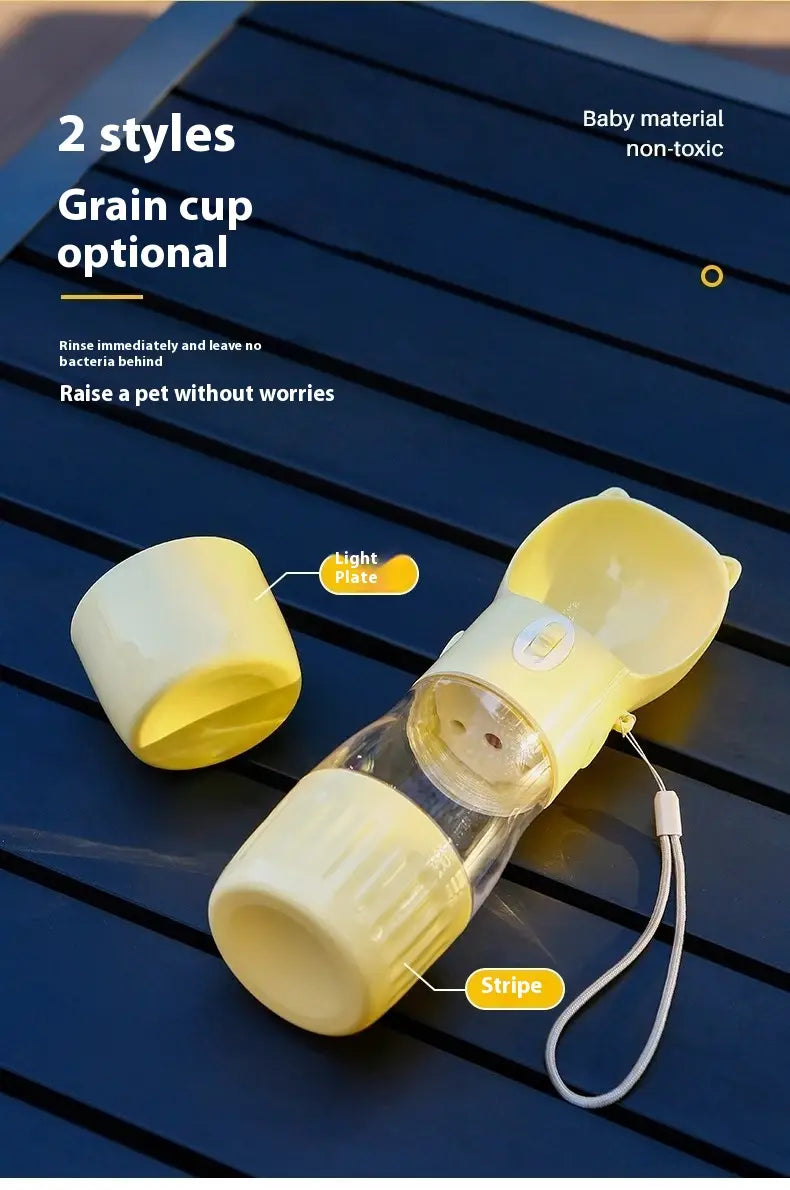 Portable cat ear pet water bottle with a yellow plastic top, clear glass body with striped design, and a detachable light plate lid.