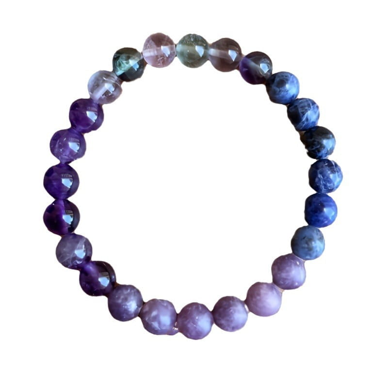 Multicolor gradient fluorite beaded bracelet featuring smooth faceted beads transitioning from deep purple to vibrant blue with crystal accent.