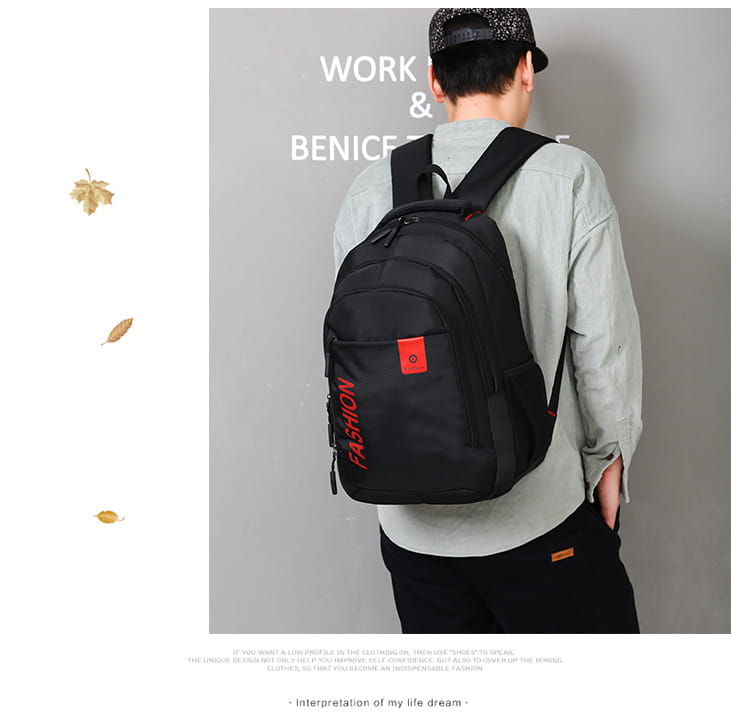 Black nylon canvas men’s laptop backpack featuring red fashion lettering and a matching orange rectangular patch on the front for school use.