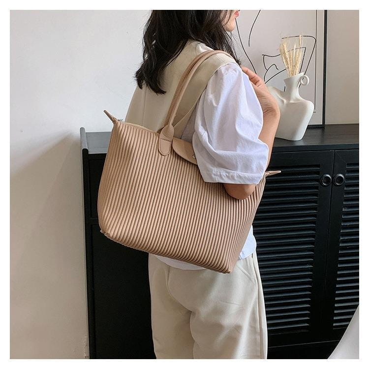 Beige ribbed canvas pleated shoulder bag with matching handles and zipper closure minimalist pu leather tote.