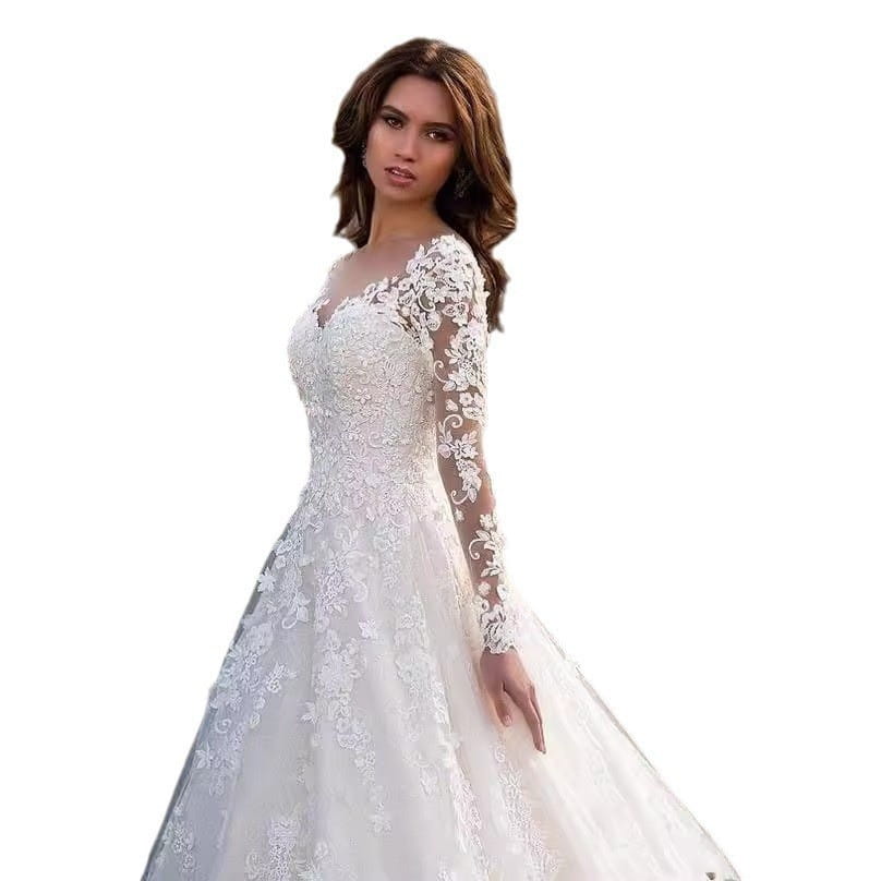 Elegant white off shoulder lace bridal wedding gown with long sleeves and a flowing skirt