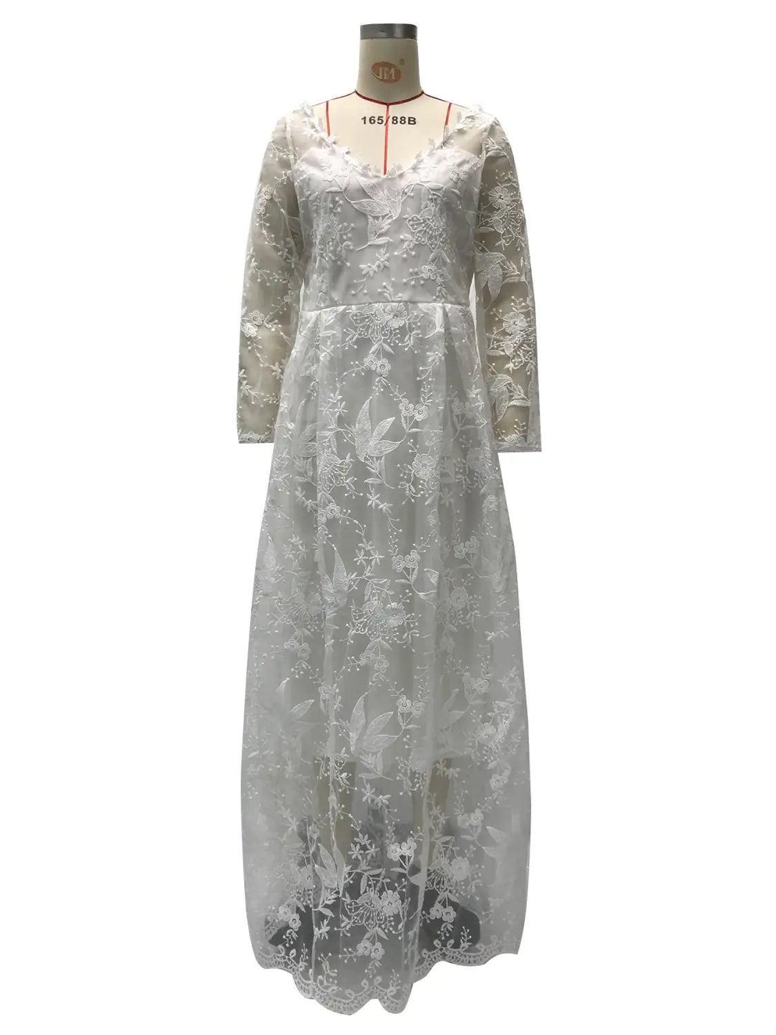 Off shoulder lace long sleeve bridal wedding gown in white featuring delicate floral embroidery and three-quarter sleeves.
