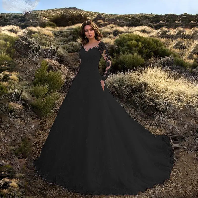 Elegant black off shoulder lace long sleeve bridal wedding gown with intricate lace detailing on the bodice and flowing full skirt.