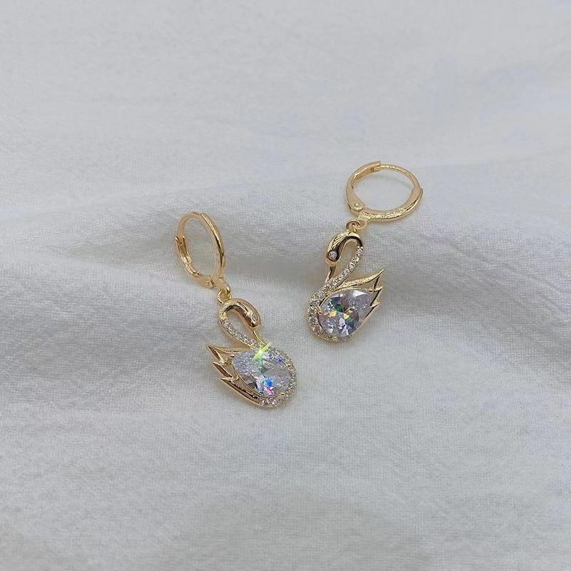Gold-toned crystal rhinestone swan drop earrings for women featuring a sparkling pear-shaped crystal body and intricate wing detailing.