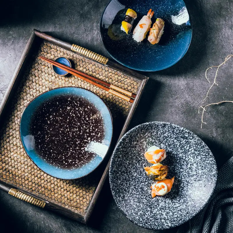 Ceramic blue speckled nordic round corner fillet plate with a rustic handcrafted finish.