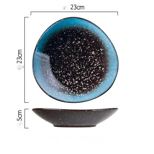 A 23cm diameter ceramic round corner fillet plate with a speckled black center and a vibrant blue rim designed in a Nordic style.