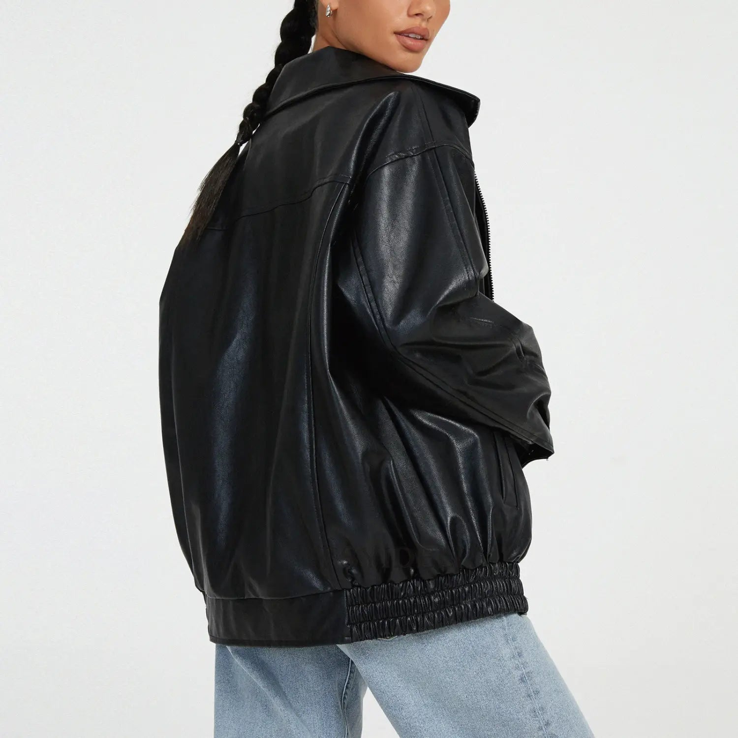 black faux leather bomber jacket with relaxed fit and elasticized waistband shown from the back side