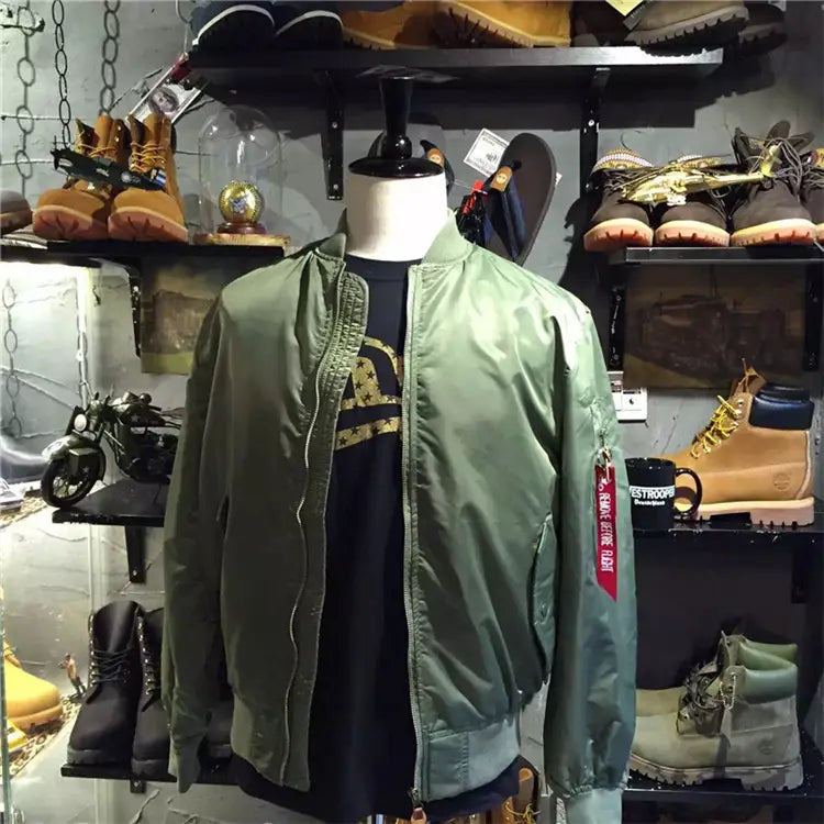 Ma1 pilot bomber jacket casual stand collar in olive green featuring a red and white patch on the sleeve.