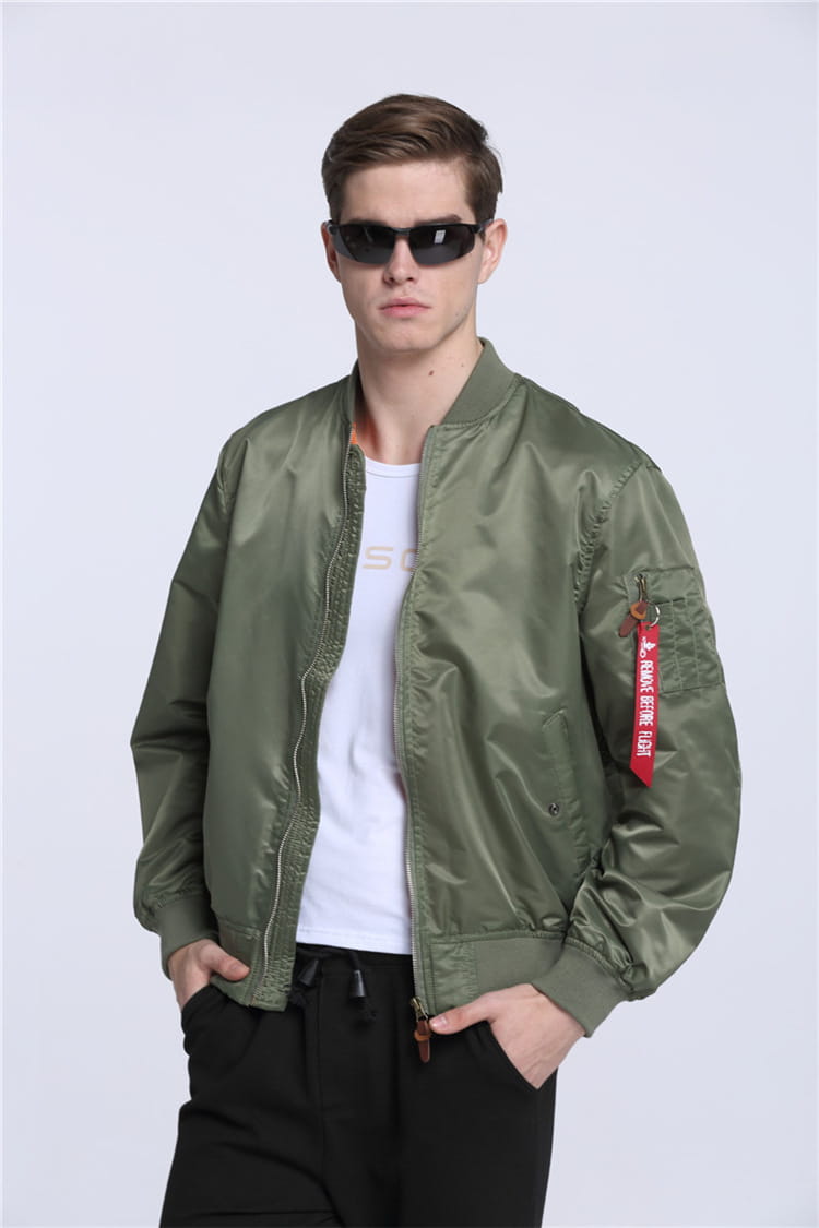 Olive green satin ma1 pilot bomber jacket with stand collar and red tag on left sleeve for casual wear.