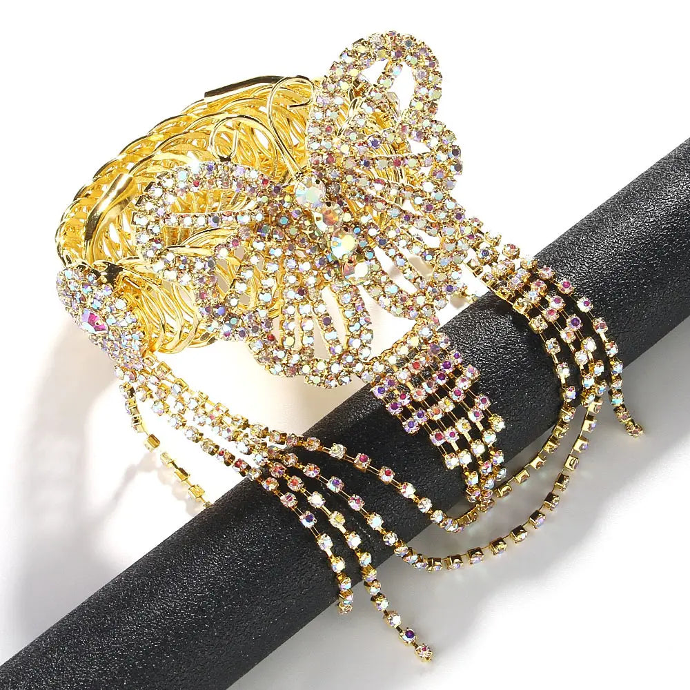 Gold-toned fairy butterfly rhinestone tassel arm chain bracelet featuring a bow shape adorned with sparkling rhinestones and cascading crystal strands.