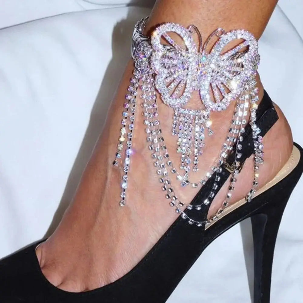 A sparkling silver fairy butterfly rhinestone tassel arm chain bracelet featuring cascading crystal chains.